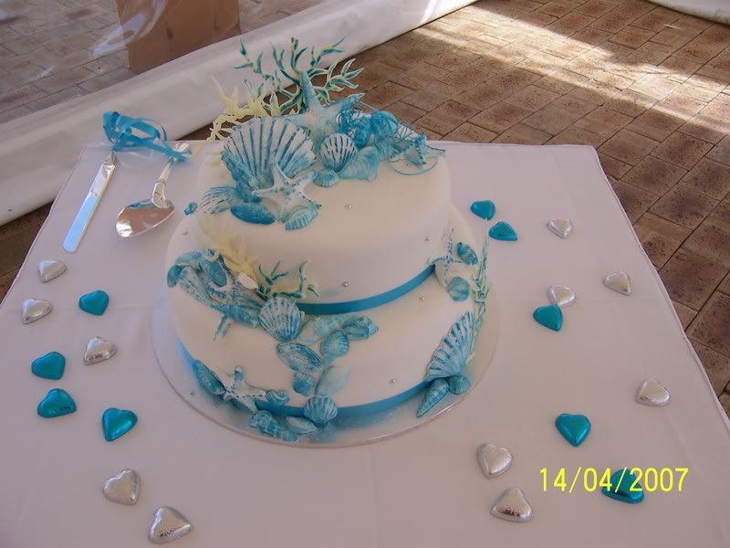  cost about 350 and themed for our beach wedding and aqua colours