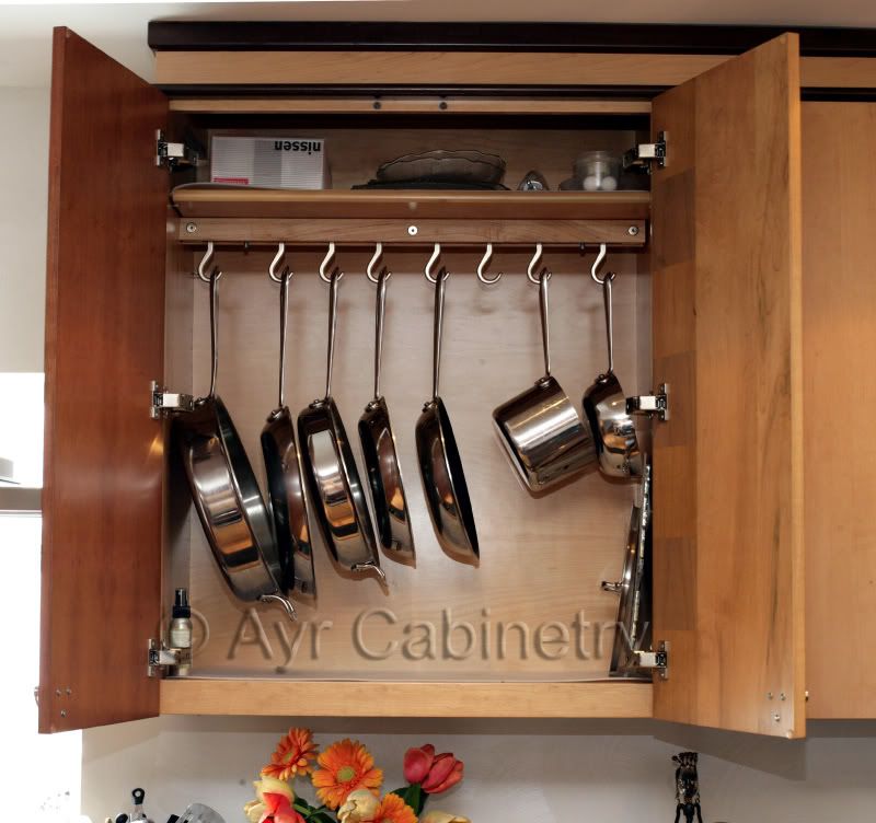 Any suggestions on storing pots and pans in upper cabinets ...
